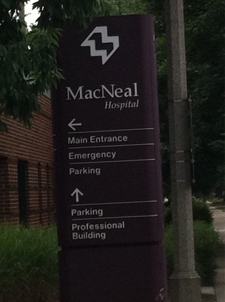 Directional sign for MacNeal Hospital indicating various facilities.