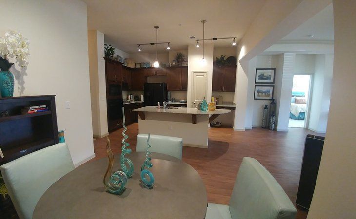 A modern, open-concept kitchen and dining area with contemporary decor.