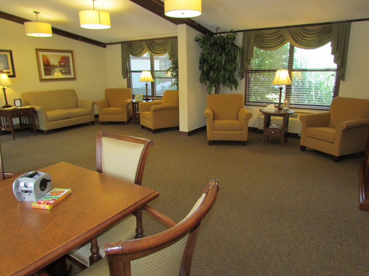 A cozy living room with comfortable seating and warm lighting.