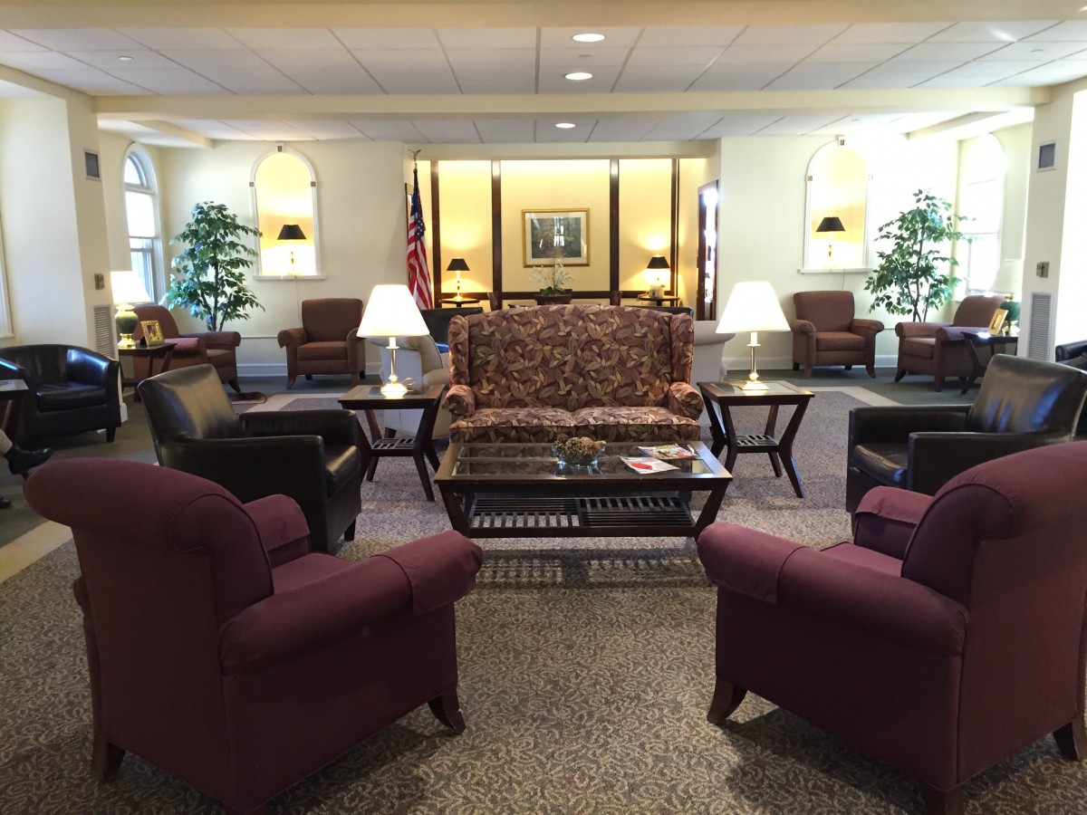 A well-furnished lobby with comfortable seating and elegant decor.