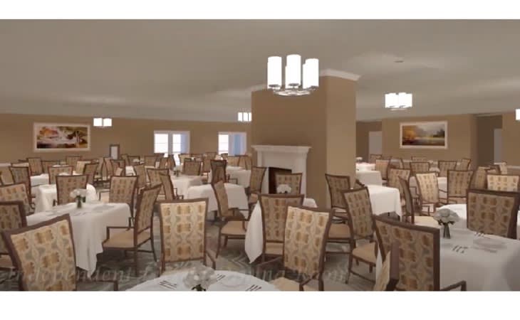 An elegant dining room with neatly arranged tables and chairs under soft lighting.