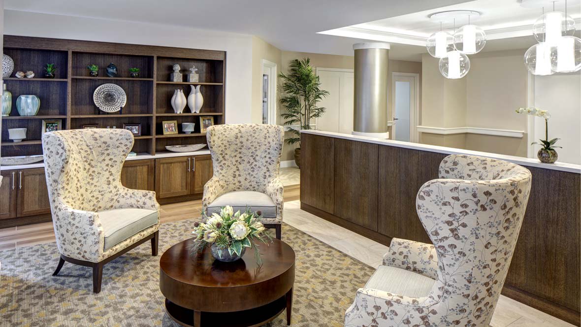 A cozy lobby area with elegant furniture and decorative elements.