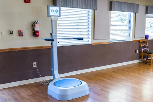A body composition analyzer set up in a bright room, designed for fitness assessments.