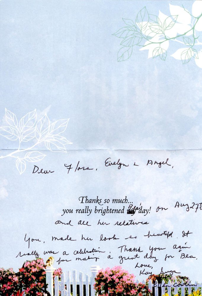A handwritten thank you note on floral stationery.