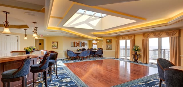 Elegant lounge area with a skylight and comfortable seating.