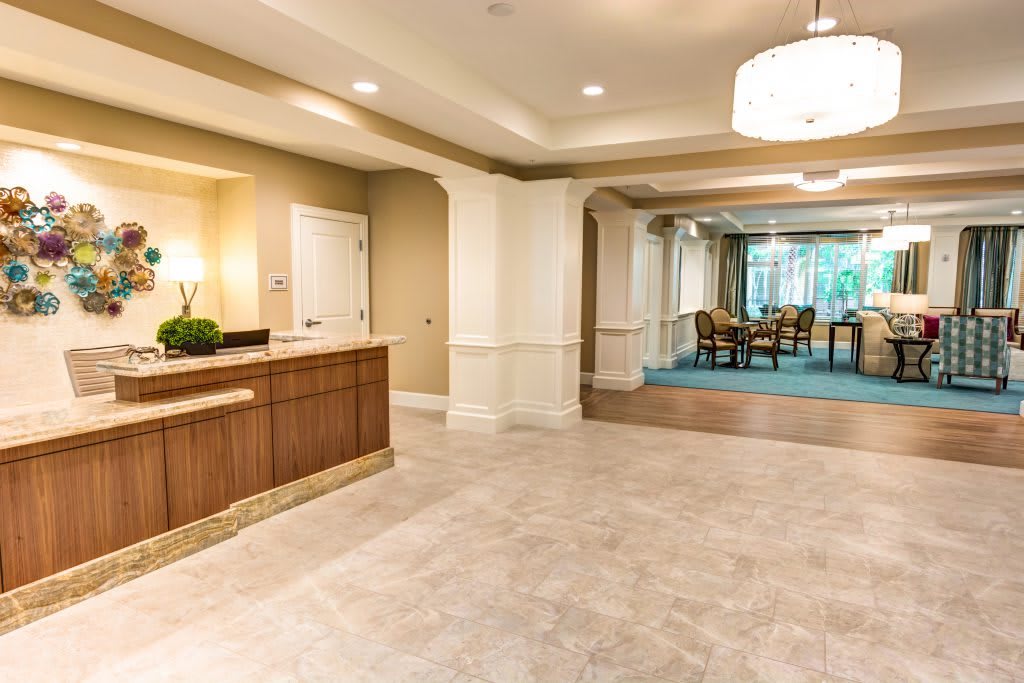 A modern reception area leading to a conference room with elegant decor.