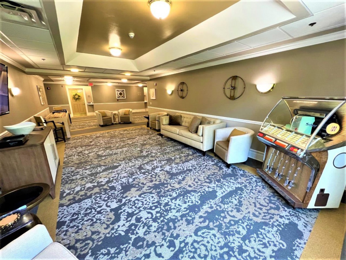 A cozy lobby area with sofas, armchairs, and decorative lighting.
