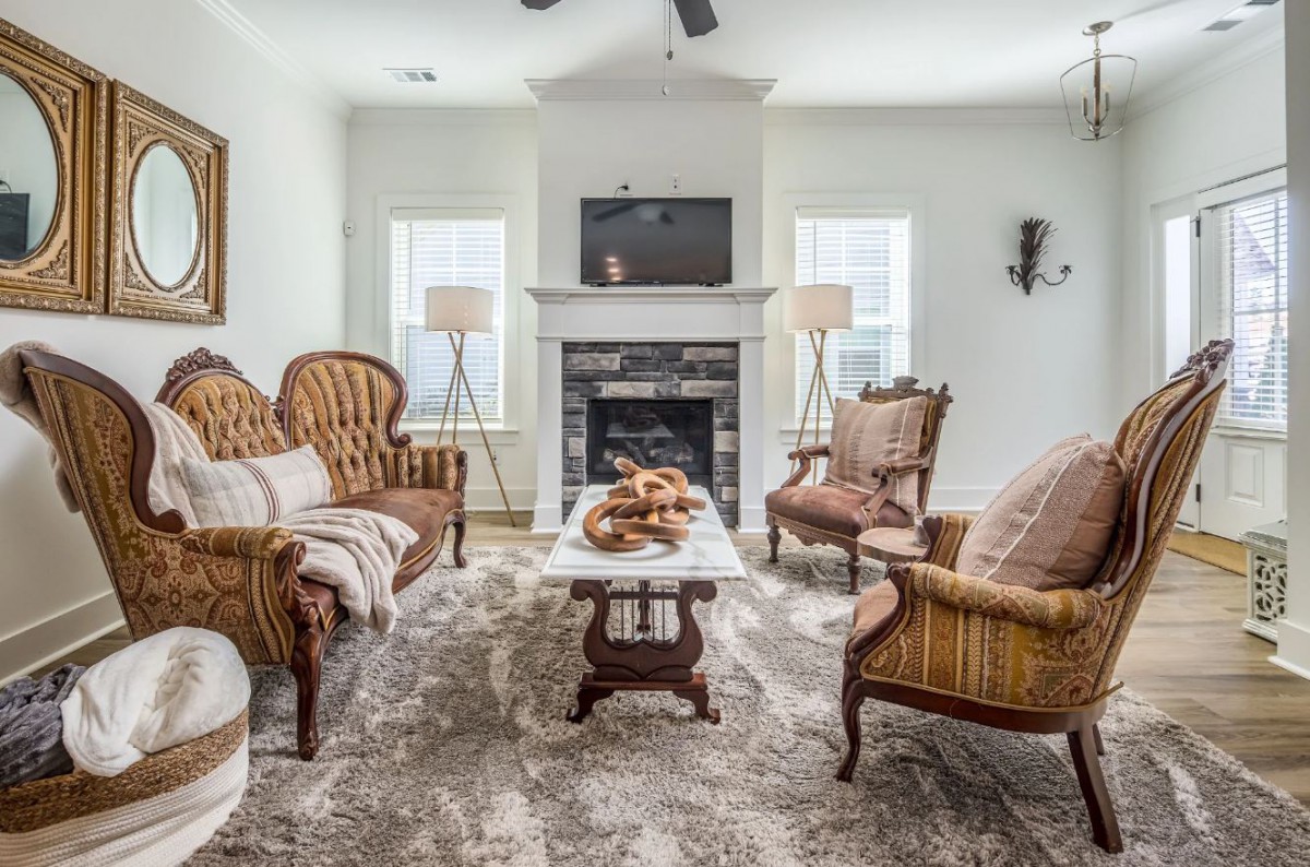 A cozy living room with classic furniture and a fireplace.