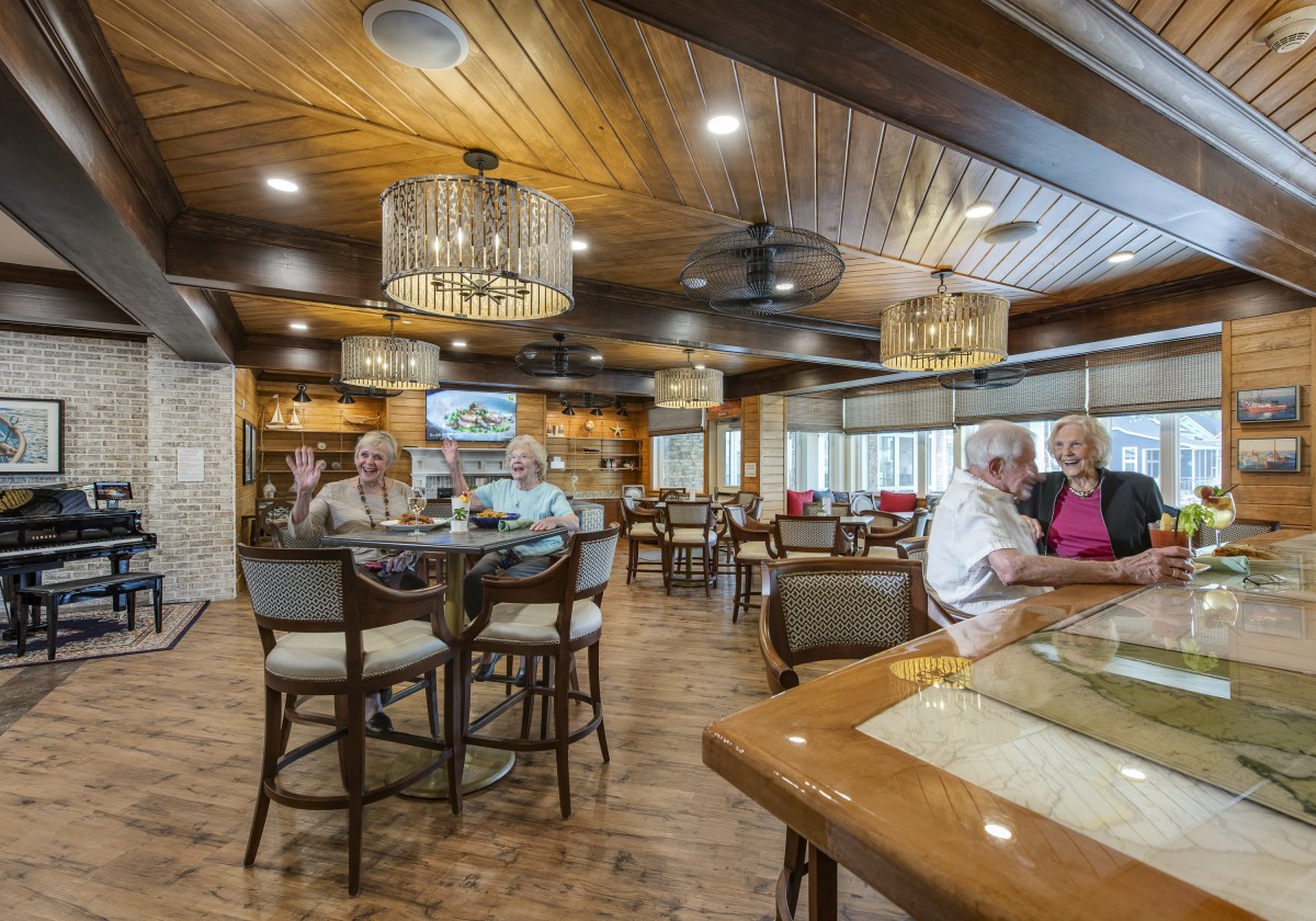 A cozy dining area with people enjoying their meals at a restaurant.
