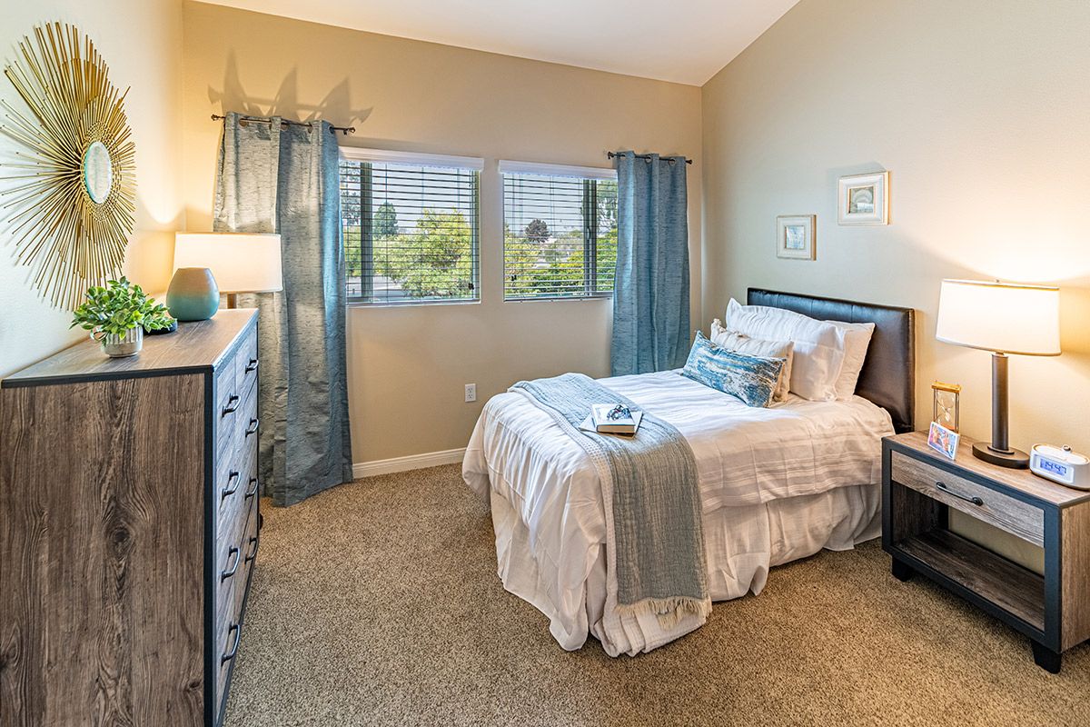 A cozy bedroom with elegant decor and natural light.