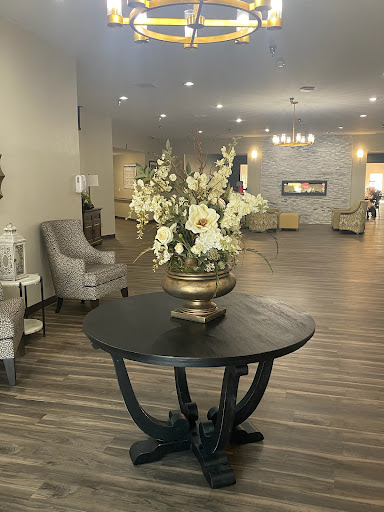 A beautifully designed lobby featuring elegant furnishings and floral arrangements.
