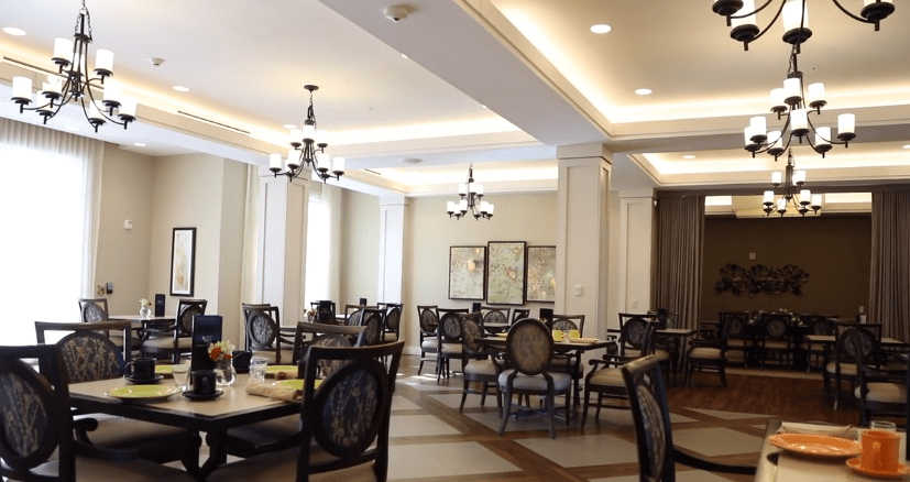 Elegant dining room with chandeliers and classic furnishings.