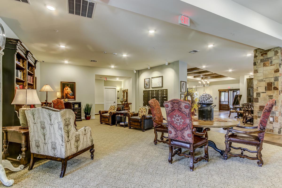 A spacious and elegantly decorated living room with comfortable seating and modern decor.