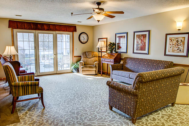 A cozy living room with elegant furniture and ample natural light.