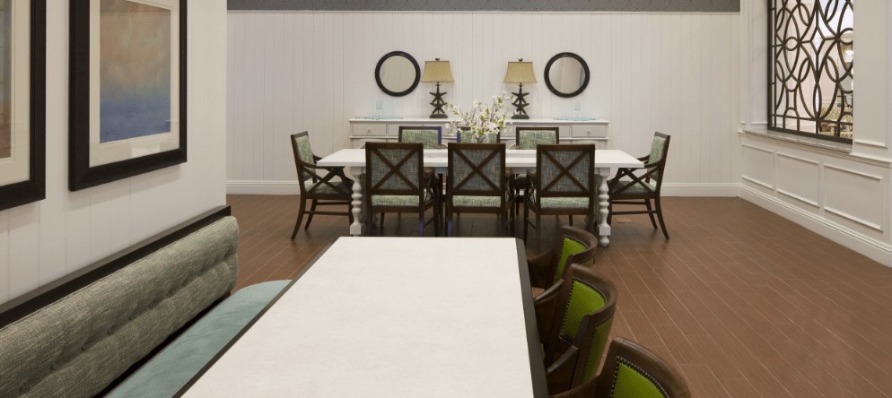 Elegant dining room with a large table, chairs, and decorative elements.