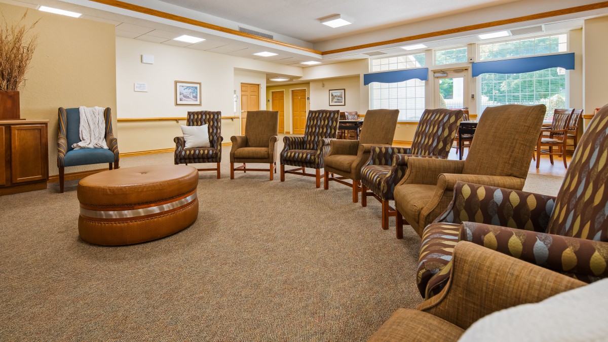 A well-arranged waiting room with several chairs in a circular setup.