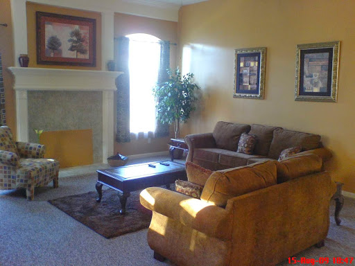 A cozy living room featuring comfortable seating and warm colors.