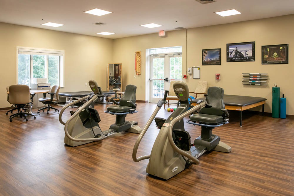 An indoor exercise room with stationary bikes and fitness equipment.
