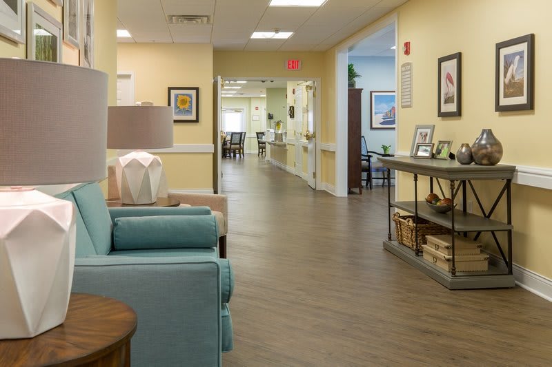 A welcoming hallway with cozy seating and decor.