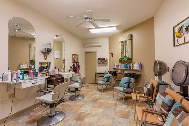 A well-organized hair salon interior with styling chairs and mirrors.