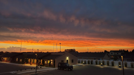 A stunning sunset casting vibrant colors over the buildings.