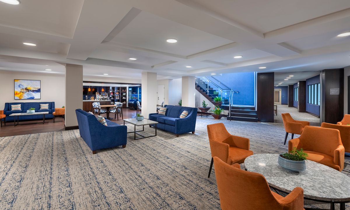 A modern hotel lobby with comfortable seating and stylish decor.
