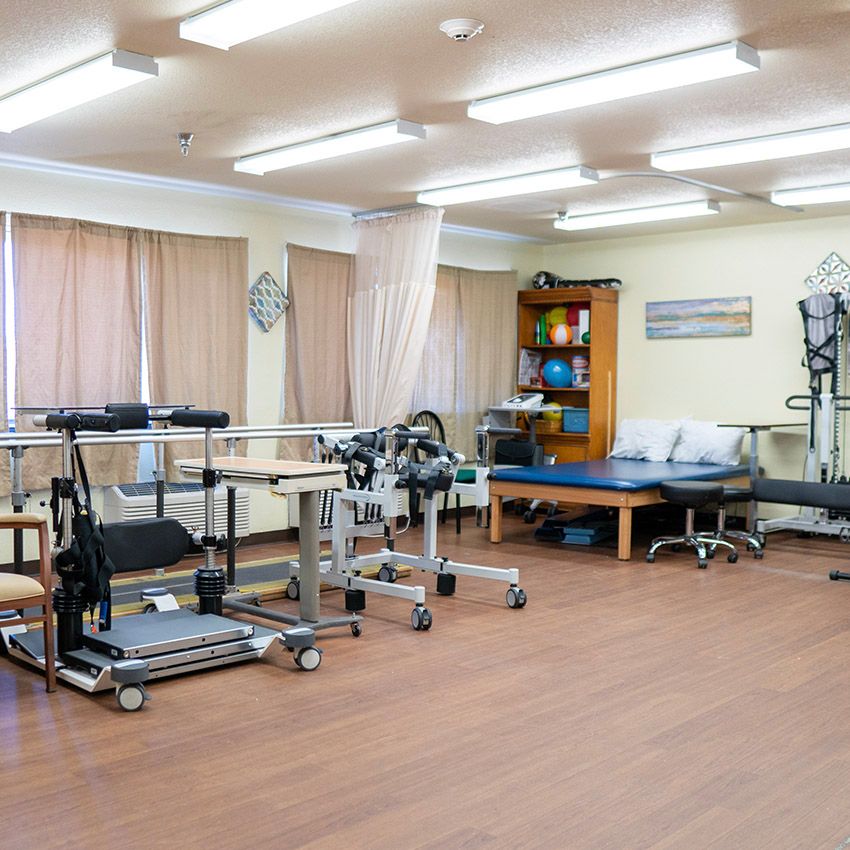 A well-equipped physical therapy room with various rehabilitation tools and equipment.