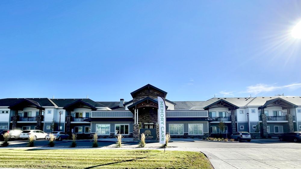 A view of a hotel or resort building with a clear blue sky above.