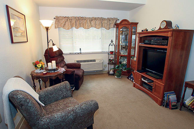 A cozy living room with comfortable seating and a television.