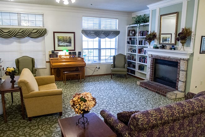 Cozy living room with classic furniture and a fireplace.