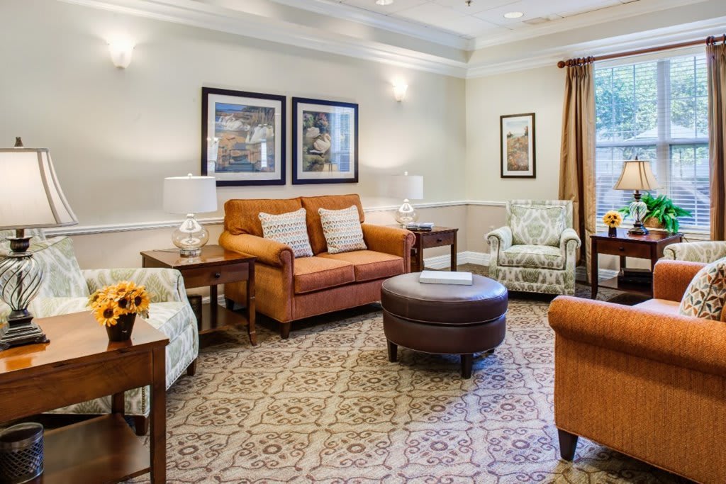 A cozy and well-decorated living room featuring comfortable seating and elegant decor.