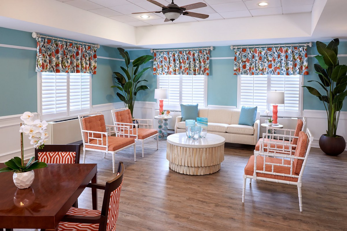 A brightly decorated living room with comfortable seating and vibrant accents.