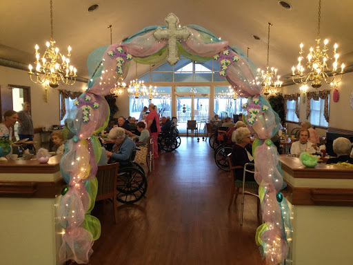 A beautifully decorated archway welcoming residents to a festive gathering in the activity center.