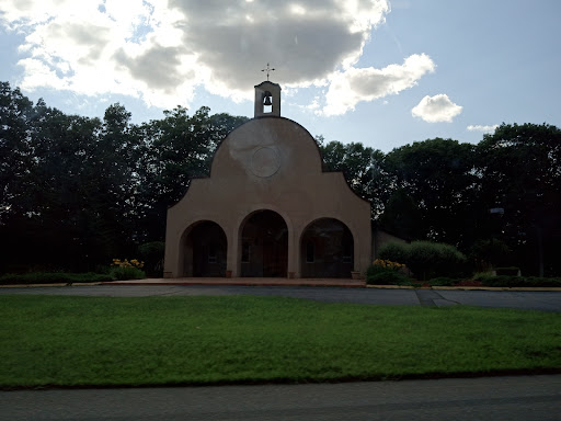 A picturesque view of a historic building set against a cloudy sky.