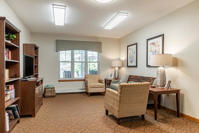 A cozy living room with comfortable seating, ambient lighting, and tasteful decor.