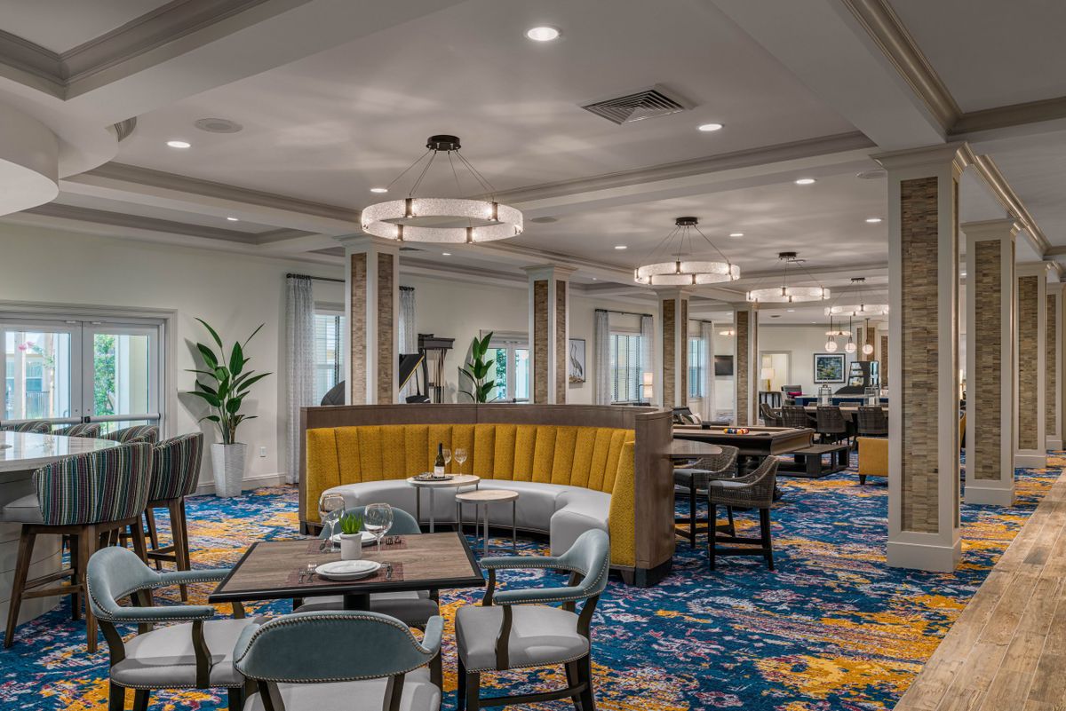A modern restaurant interior with stylish seating and lighting.