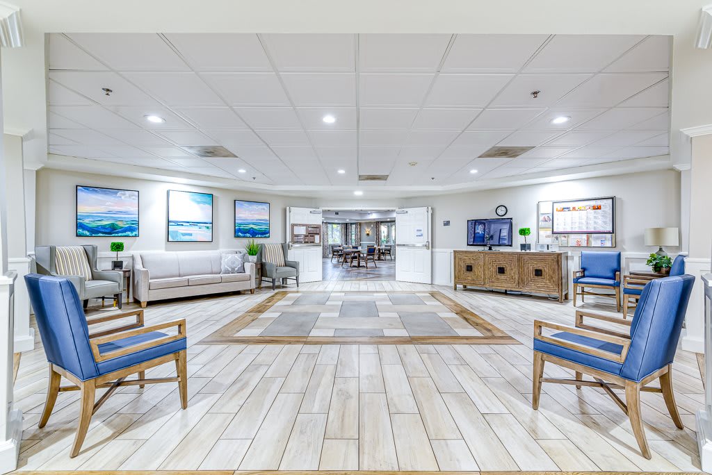 A spacious and well-lit lobby with seating arrangements and decor.