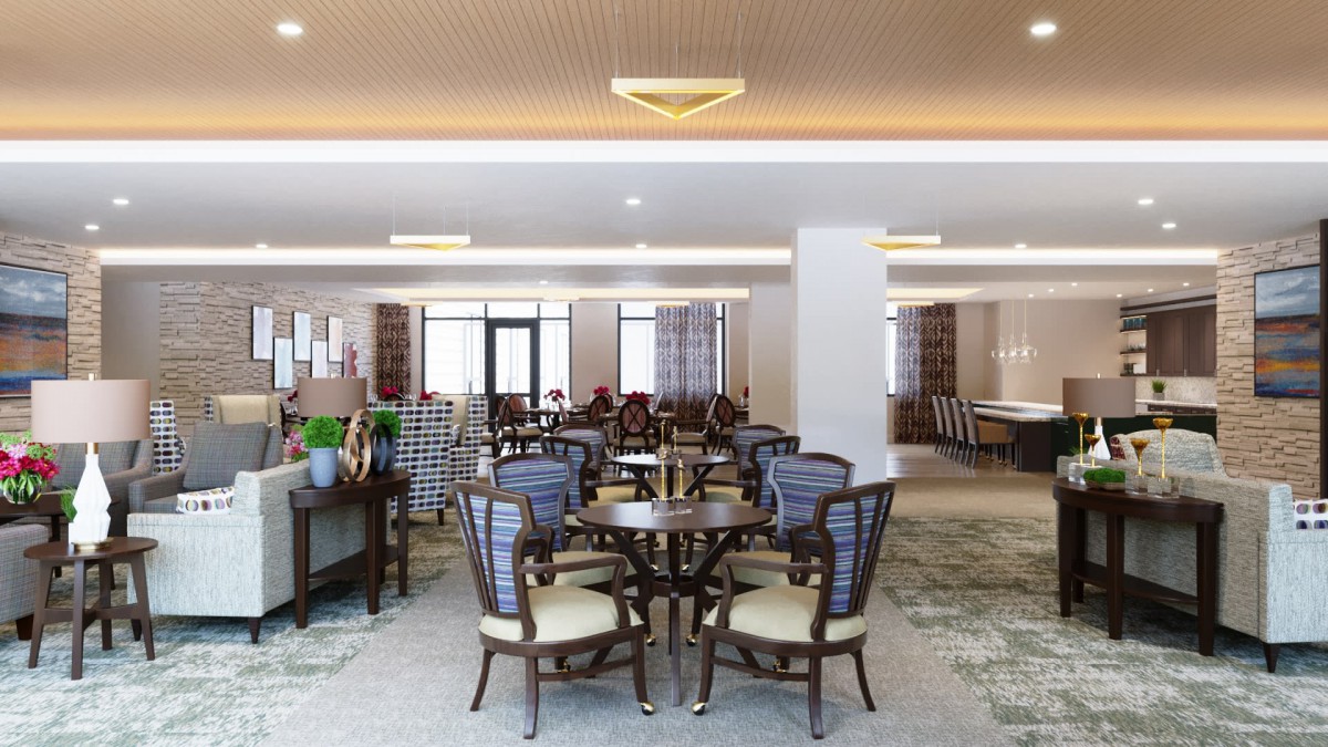 A spacious and elegantly designed dining area with classic furniture and soft lighting.