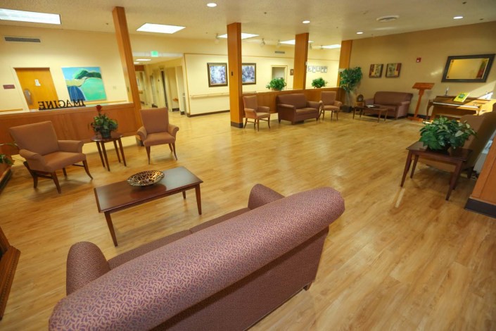 A spacious and well-lit waiting area with comfortable seating arrangements.