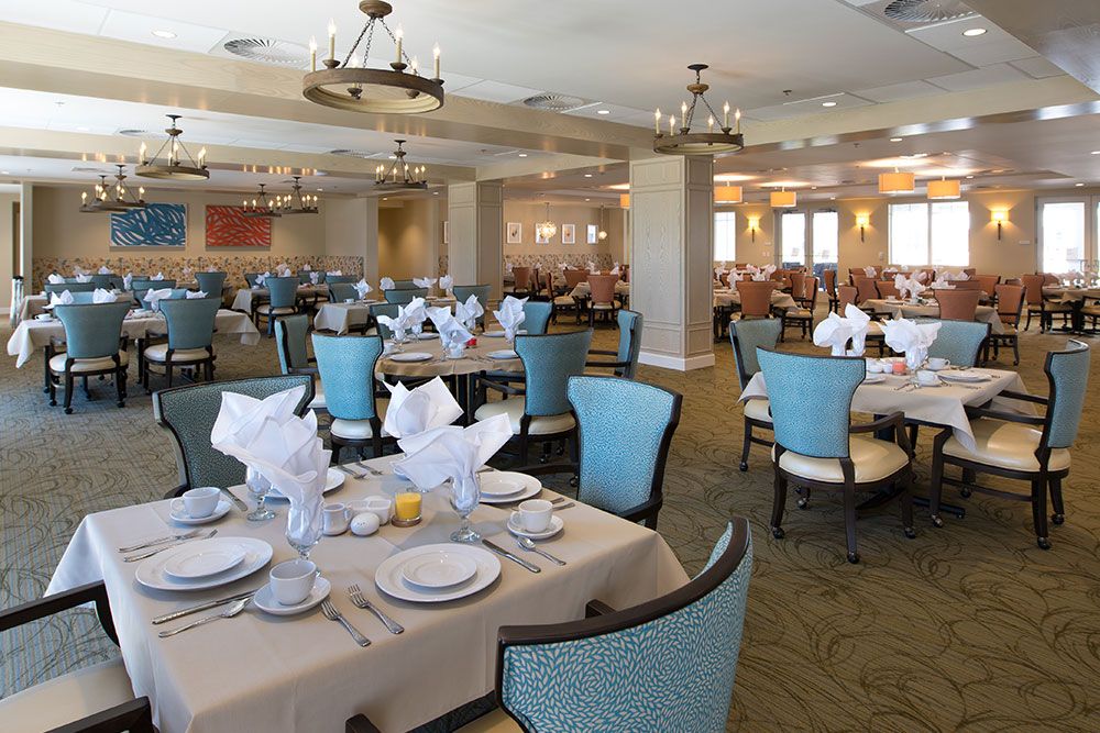 A spacious dining area with neatly set tables and elegant decor.