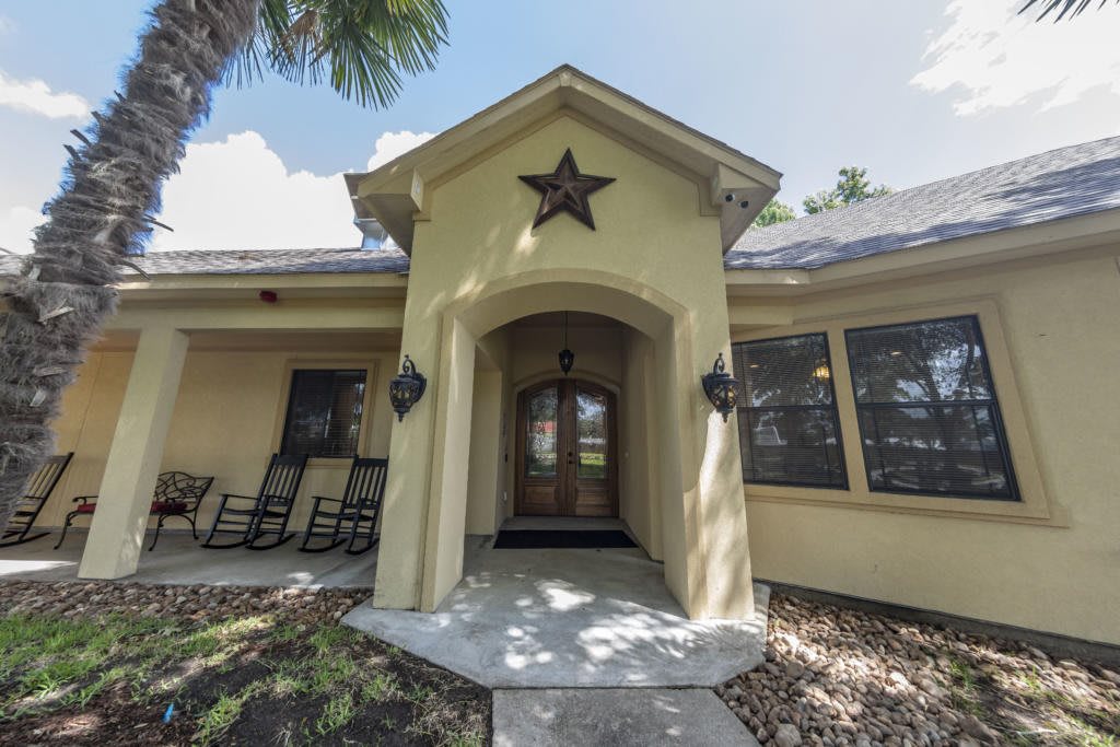 A welcoming entrance to a residential home with a star decoration above the door.