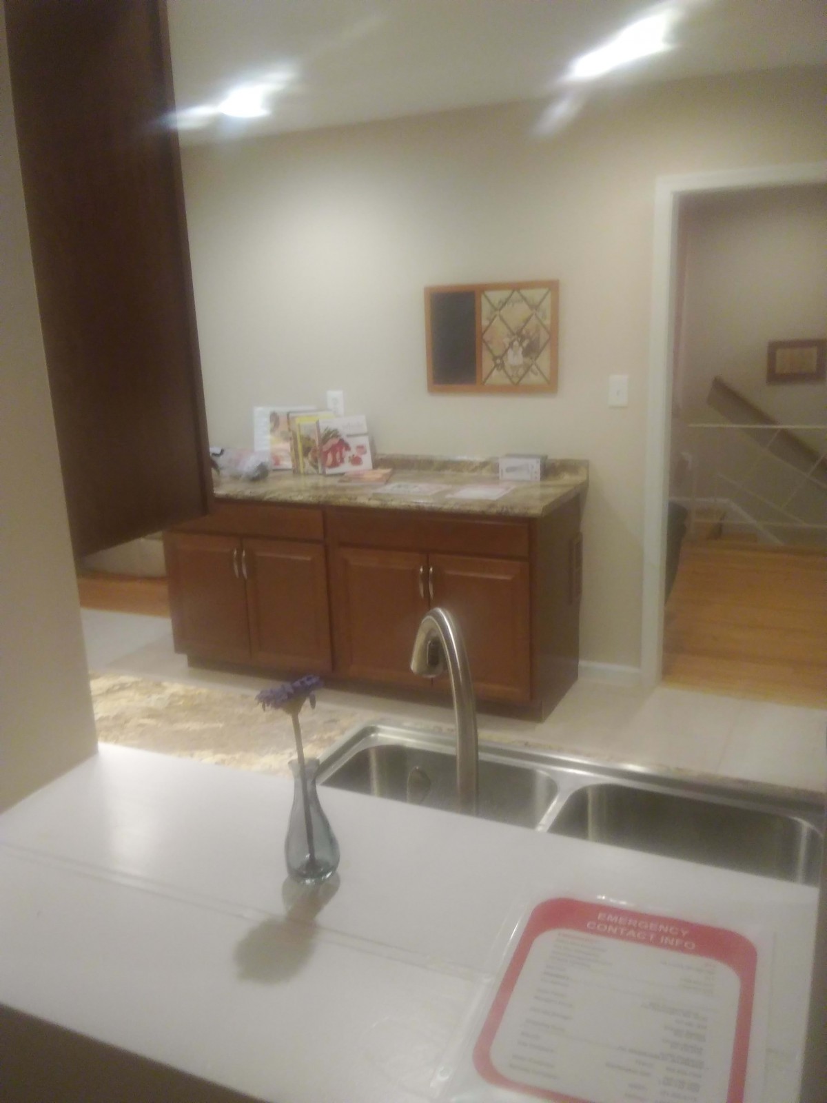 A modern kitchen with a sleek design, featuring a sink, cabinets, and countertop.