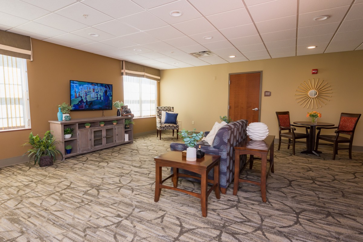 A cozy living room with comfortable seating and a television.