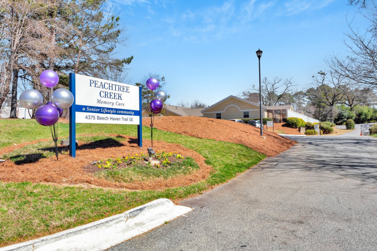 Entrance to Peach River Creek Retirement Home with visible signage and landscaping.