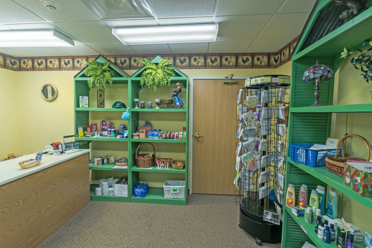 Interior view of a pet shop with shelves stocked with various pet supplies.
