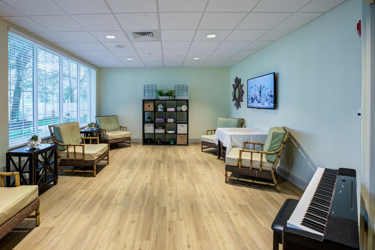 A spacious, modern living room with comfortable seating and hardwood flooring.