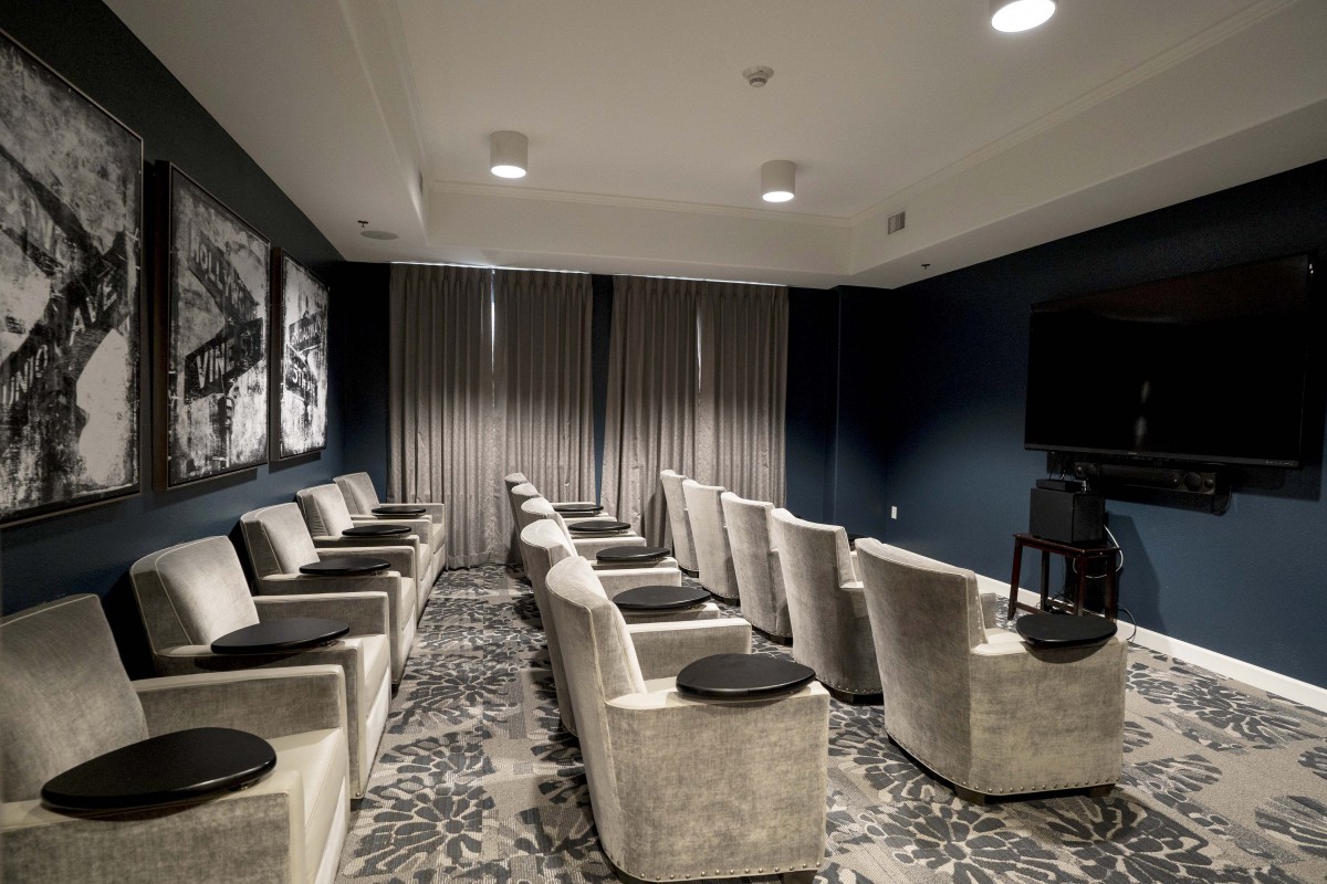 A modern home theater with plush seating and elegant decor.