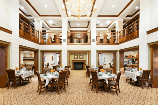 A luxurious dining room with elegant decor and a grand chandelier.