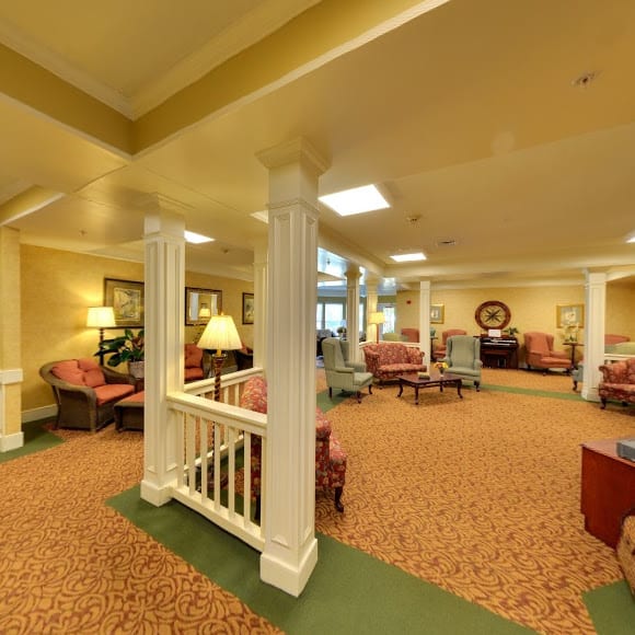 A spacious and well-lit lobby area featuring comfortable seating and elegant decor.