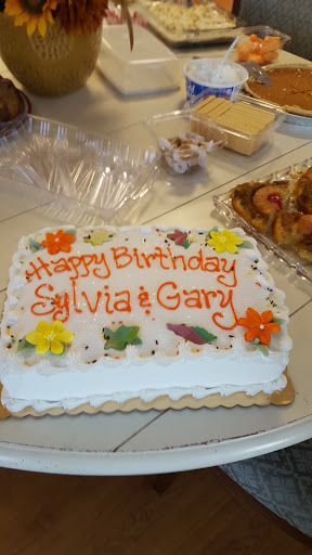 A festive birthday cake celebrating Sylvia and Gary's special day.